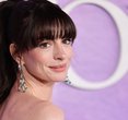 Anne Hathaway Elevates Office Style by Layering Lingerie with Menswear