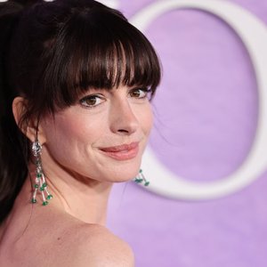 Anne Hathaway Elevates Office Style by Layering Lingerie with Menswear