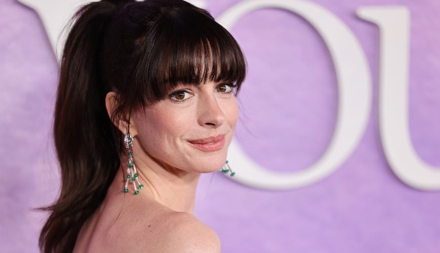 Anne Hathaway Elevates Office Style by Layering Lingerie with Menswear