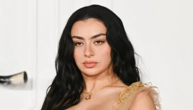 Charli XCX Turns Heads with Risqué Two-Button Jacket Look