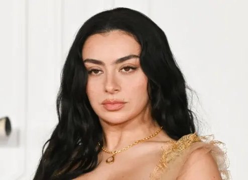 Charli XCX Turns Heads with Risqué Two-Button Jacket Look