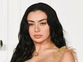 Charli XCX Turns Heads with Risqué Two-Button Jacket Look
