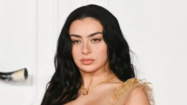 Charli XCX Turns Heads with Risqué Two-Button Jacket Look
