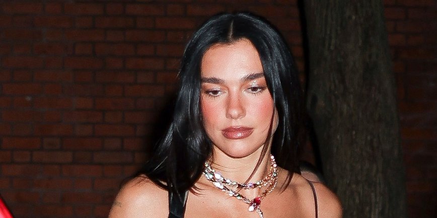 Dua Lipa Turns Heads in Daring Sheer Minidress with Feather Trim