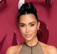 Kim Kardashian Dazzles in Plunging Latex at Kylie’s Starry Cosmetics Bash