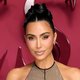 Kim Kardashian Dazzles in Plunging Latex at Kylie’s Starry Cosmetics Bash