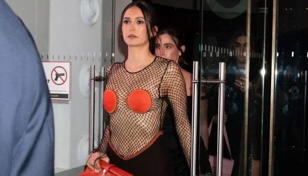 Nina Dobrev Turns Heads in Daring Fishnet Ensemble