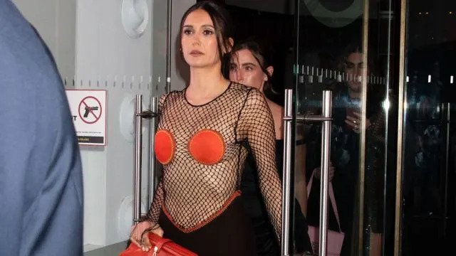 Nina Dobrev Turns Heads in Daring Fishnet Ensemble